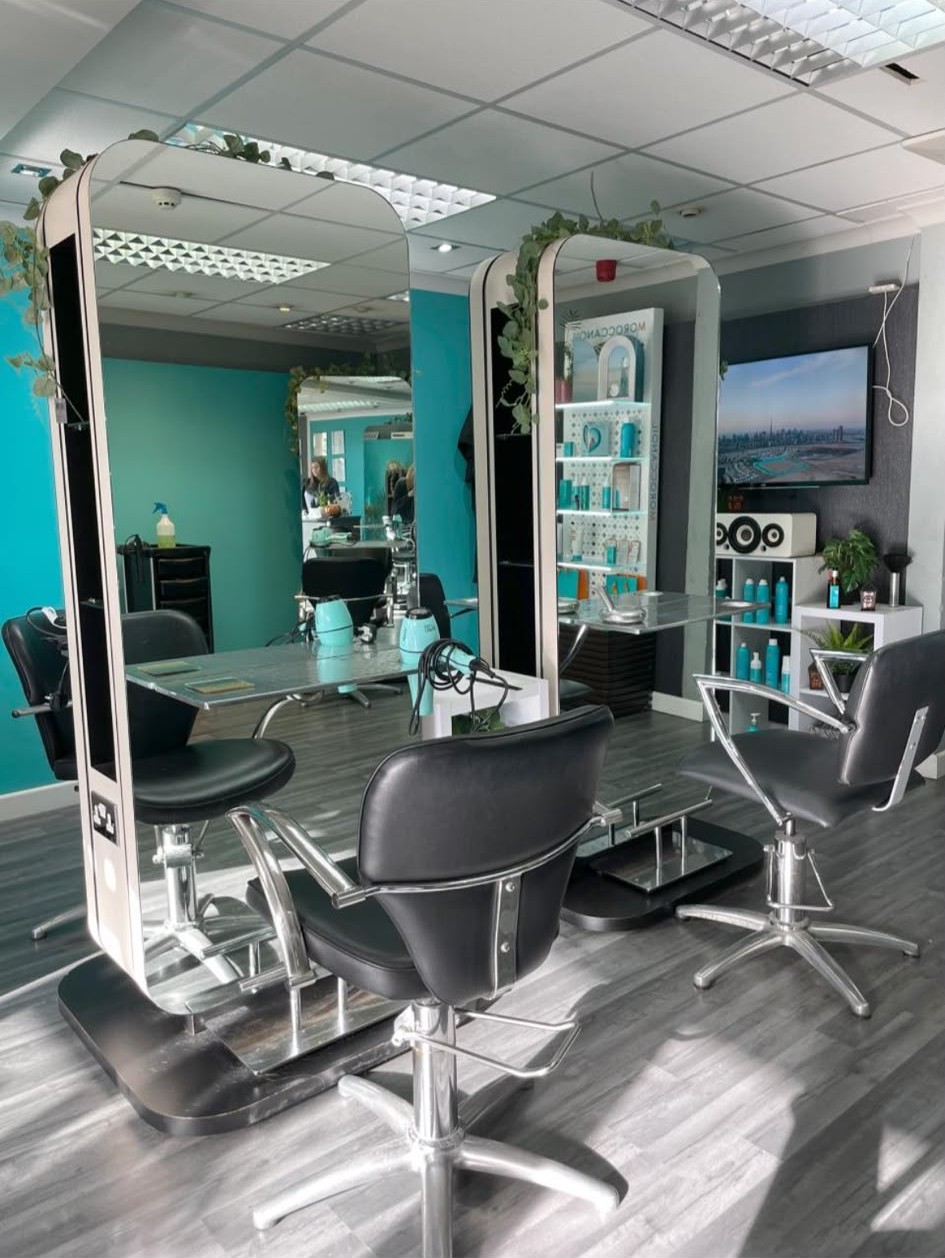 The La'torias salon floor with mirrored stations and Moroccanoil display