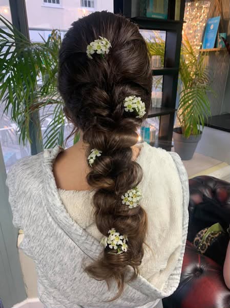 Loose bridal braid finished with small white flowers