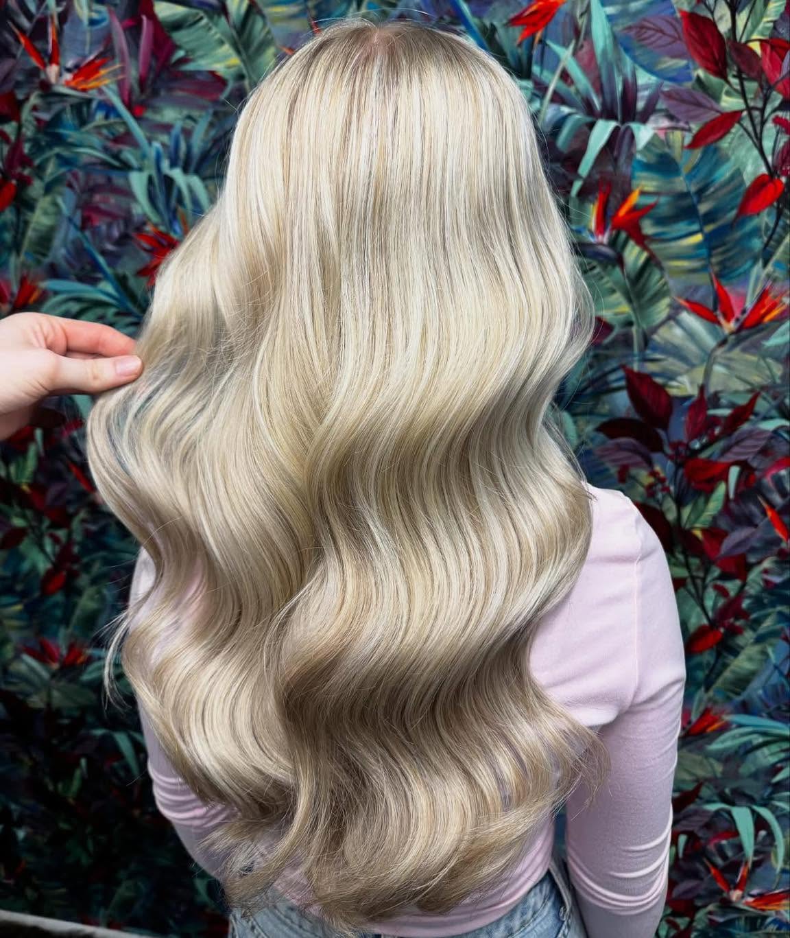 Rich platinum blonde with glossy hand-painted waves