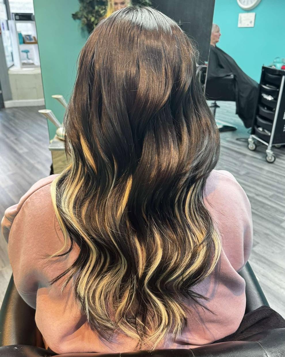 Dark brunette with face-framing blonde balayage